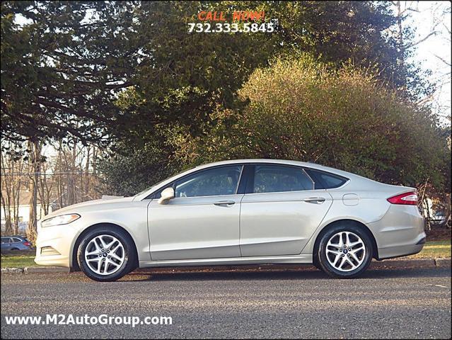 used 2015 Ford Fusion car, priced at $5,900