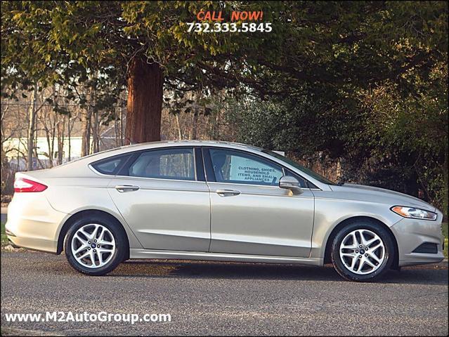 used 2015 Ford Fusion car, priced at $5,900