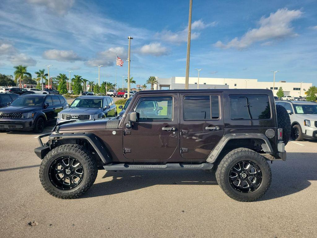 used 2013 Jeep Wrangler Unlimited car, priced at $16,799
