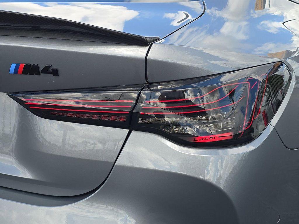 used 2022 BMW M4 car, priced at $64,074