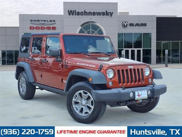 used 2014 Jeep Wrangler Unlimited car, priced at $22,079