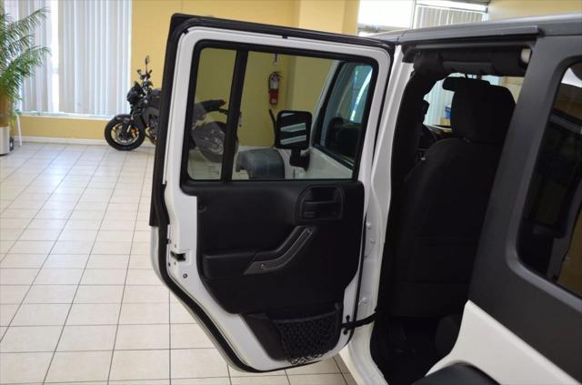 used 2014 Jeep Wrangler Unlimited car, priced at $15,741
