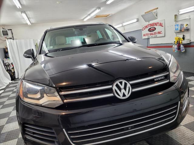 used 2014 Volkswagen Touareg Hybrid car, priced at $15,895