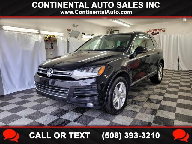 used 2014 Volkswagen Touareg Hybrid car, priced at $15,895