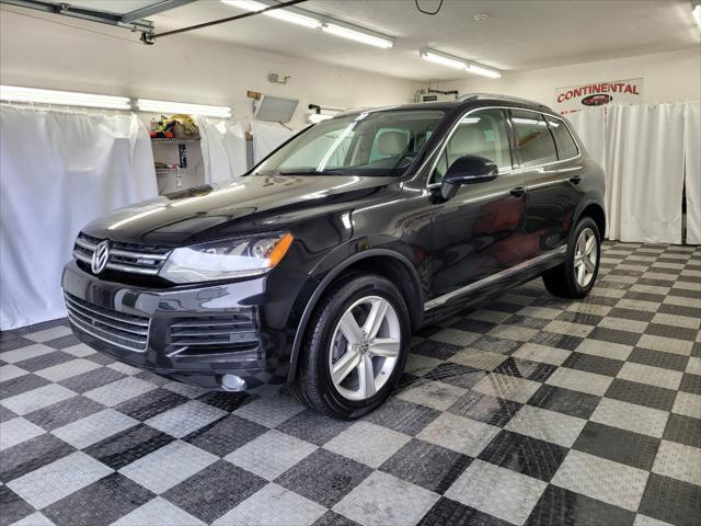 used 2014 Volkswagen Touareg Hybrid car, priced at $15,895