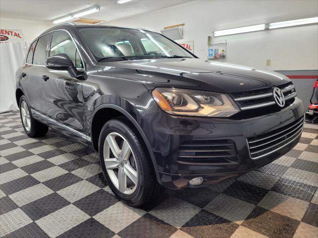 used 2014 Volkswagen Touareg Hybrid car, priced at $15,895