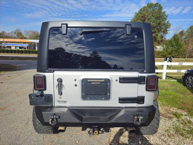 used 2012 Jeep Wrangler Unlimited car, priced at $13,999