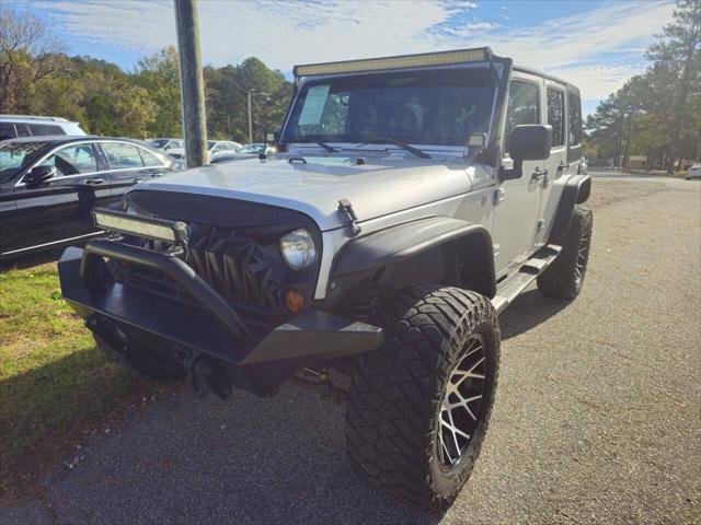 used 2012 Jeep Wrangler Unlimited car, priced at $13,999