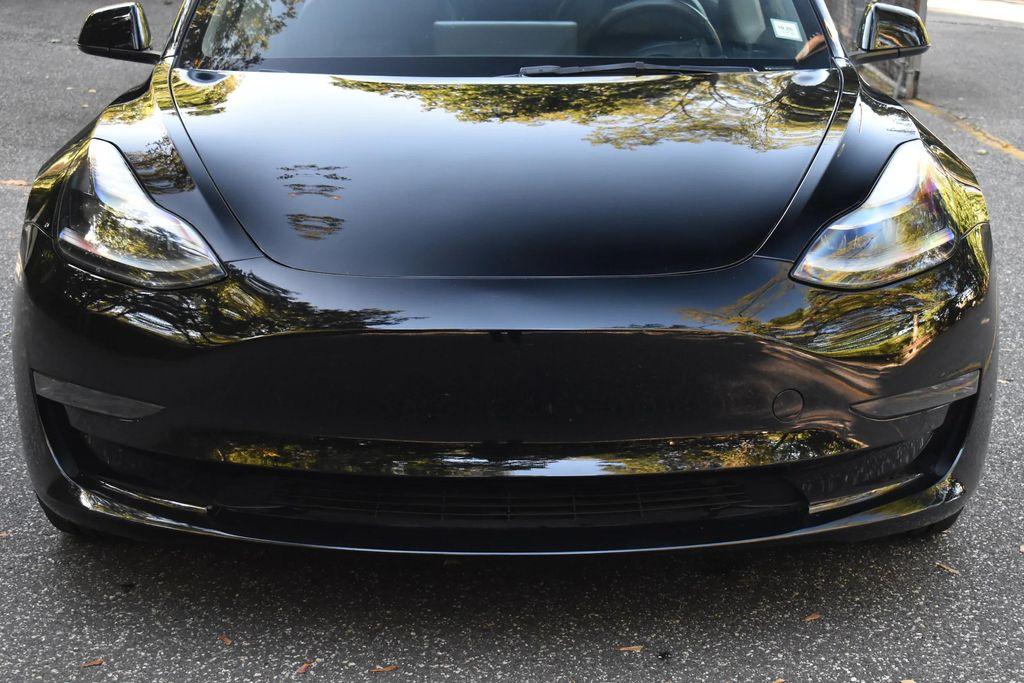 used 2023 Tesla Model 3 car, priced at $14,695