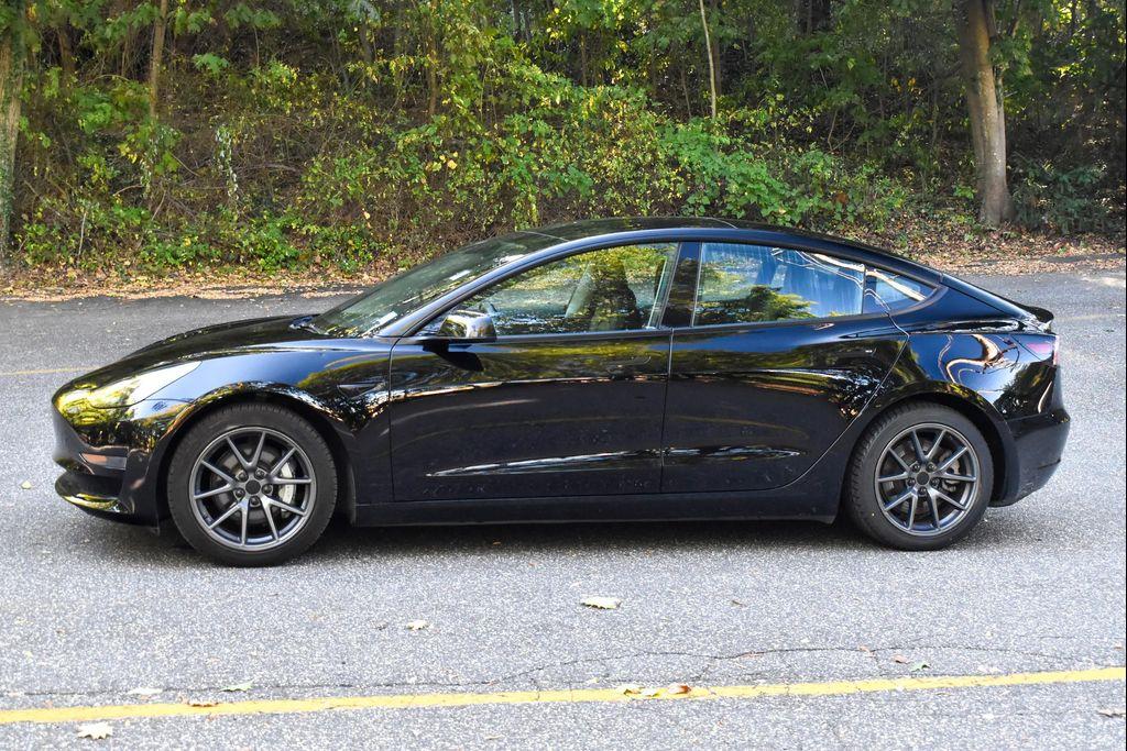 used 2023 Tesla Model 3 car, priced at $14,695