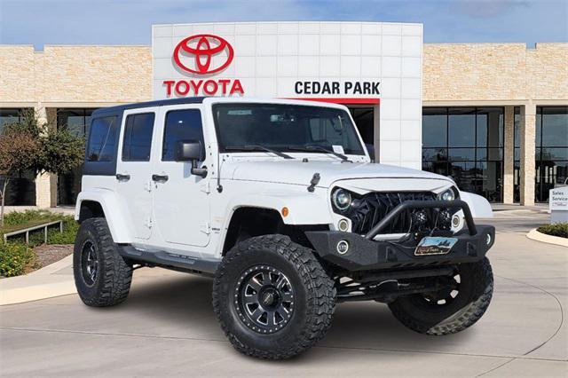 used 2015 Jeep Wrangler Unlimited car, priced at $21,291