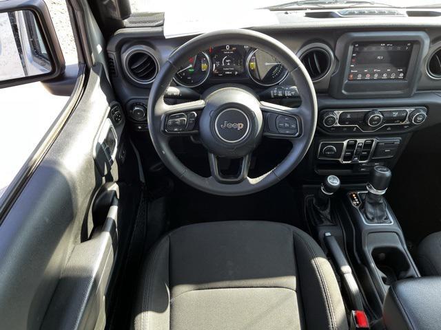 used 2023 Jeep Wrangler 4xe car, priced at $27,673