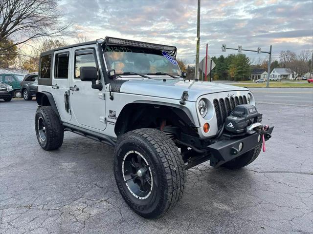 used 2010 Jeep Wrangler Unlimited car, priced at $13,995