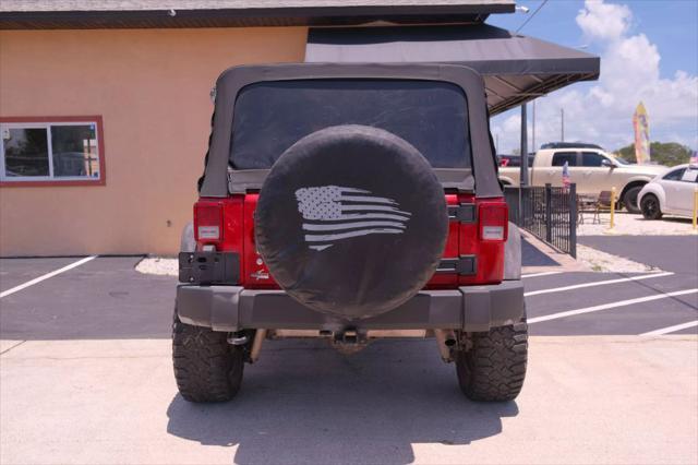 used 2014 Jeep Wrangler Unlimited car, priced at $12,988