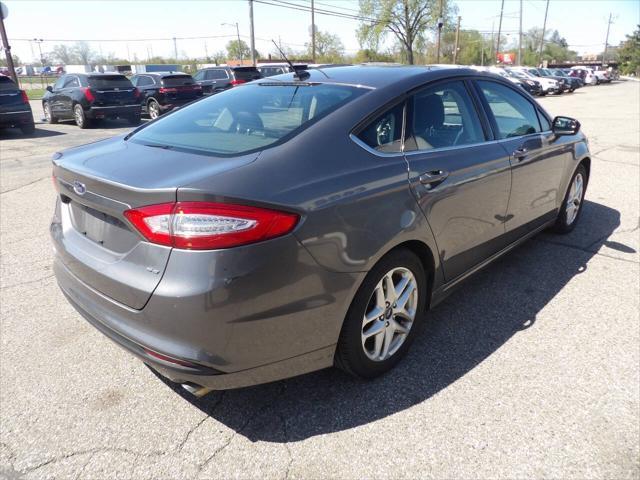 used 2014 Ford Fusion car, priced at $5,997