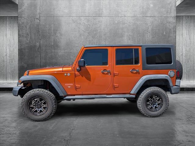 used 2011 Jeep Wrangler Unlimited car, priced at $12,992
