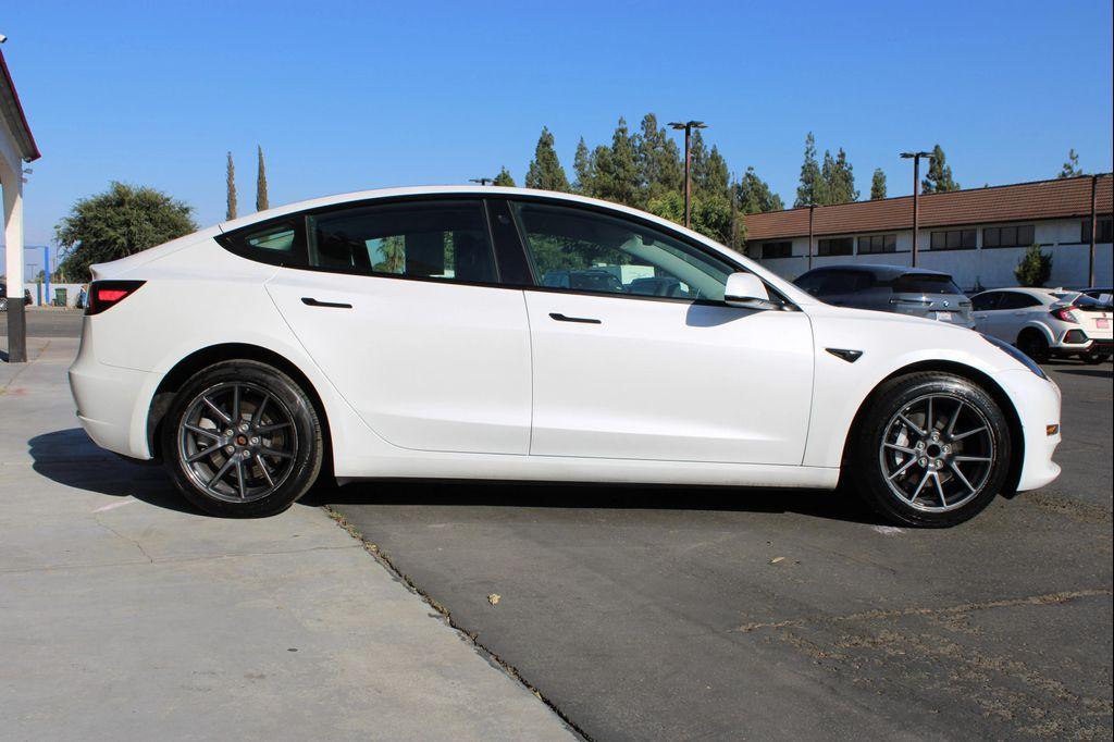used 2023 Tesla Model 3 car, priced at $22,100