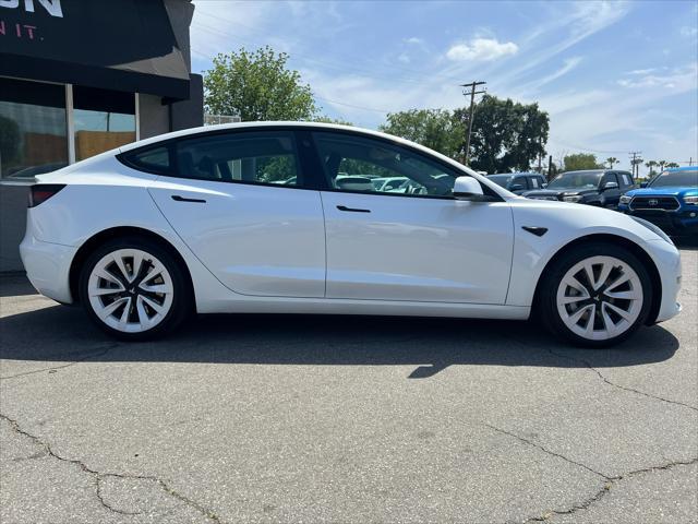 used 2023 Tesla Model 3 car, priced at $24,000
