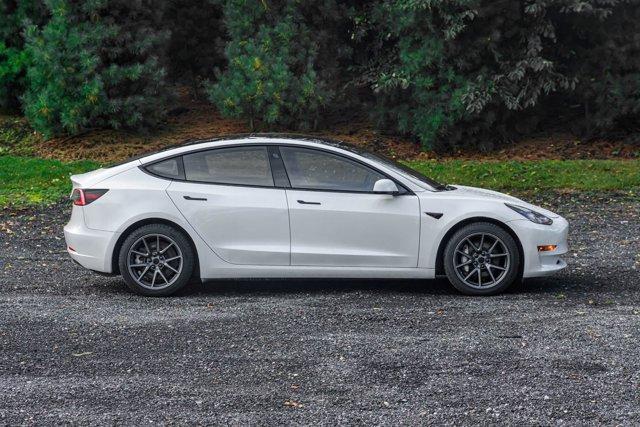 used 2023 Tesla Model 3 car, priced at $15,295
