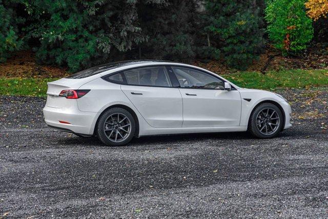 used 2023 Tesla Model 3 car, priced at $15,295