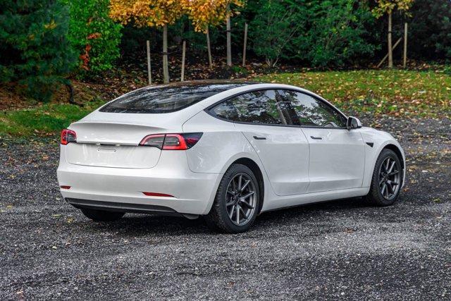 used 2023 Tesla Model 3 car, priced at $15,295