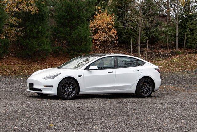 used 2023 Tesla Model 3 car, priced at $18,295