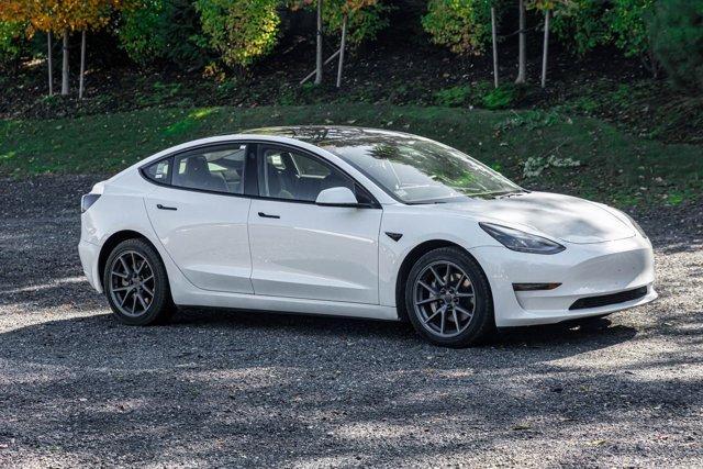used 2023 Tesla Model 3 car, priced at $17,695