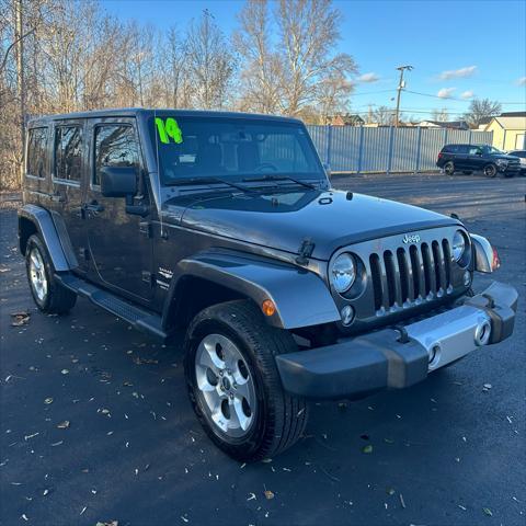 used 2014 Jeep Wrangler Unlimited car, priced at $22,290