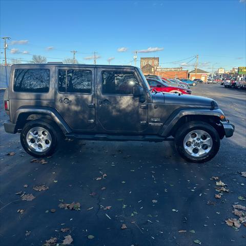 used 2014 Jeep Wrangler Unlimited car, priced at $22,290