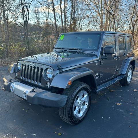 used 2014 Jeep Wrangler Unlimited car, priced at $22,290