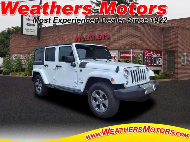 used 2018 Jeep Wrangler JK Unlimited car, priced at $23,394