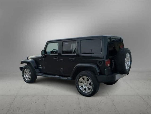 used 2011 Jeep Wrangler Unlimited car, priced at $15,004