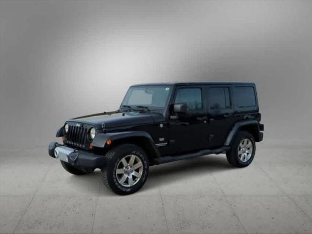 used 2011 Jeep Wrangler Unlimited car, priced at $15,004