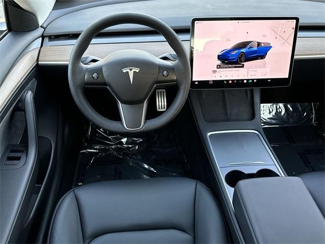 used 2023 Tesla Model 3 car, priced at $31,000