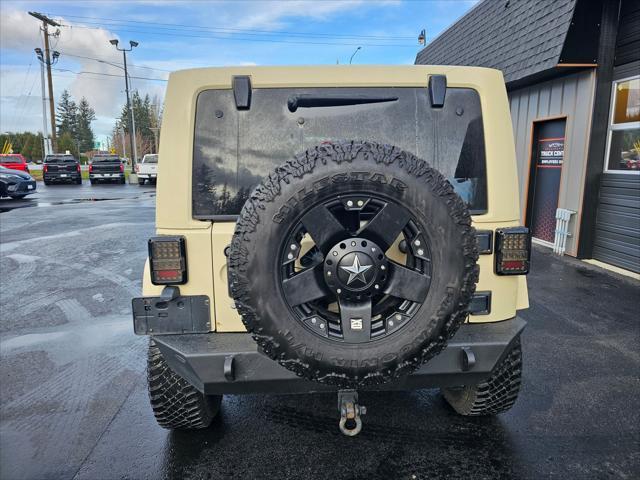 used 2011 Jeep Wrangler Unlimited car, priced at $14,850