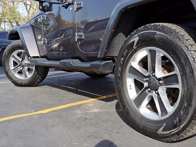 used 2014 Jeep Wrangler Unlimited car, priced at $17,495