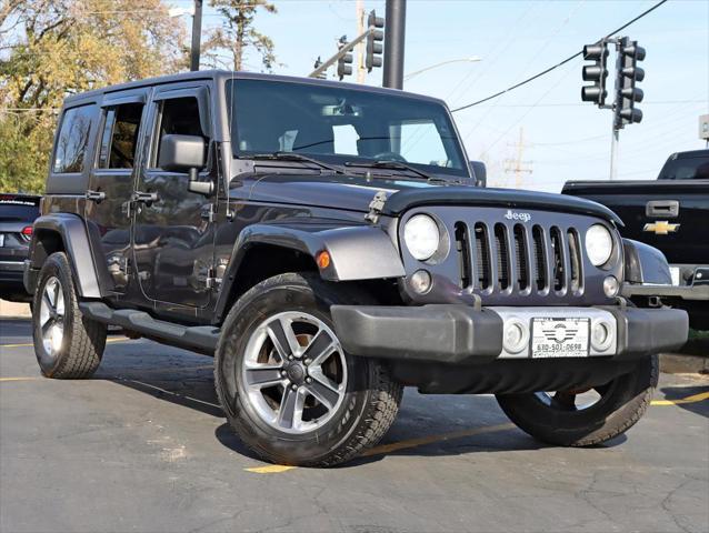 used 2014 Jeep Wrangler Unlimited car, priced at $17,495