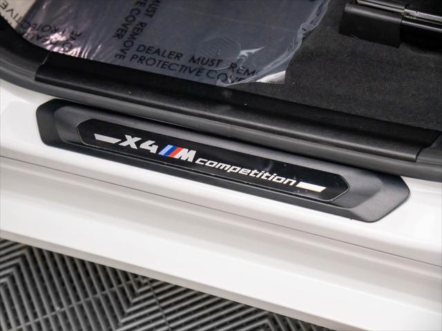 used 2024 BMW X4 M car, priced at $76,000