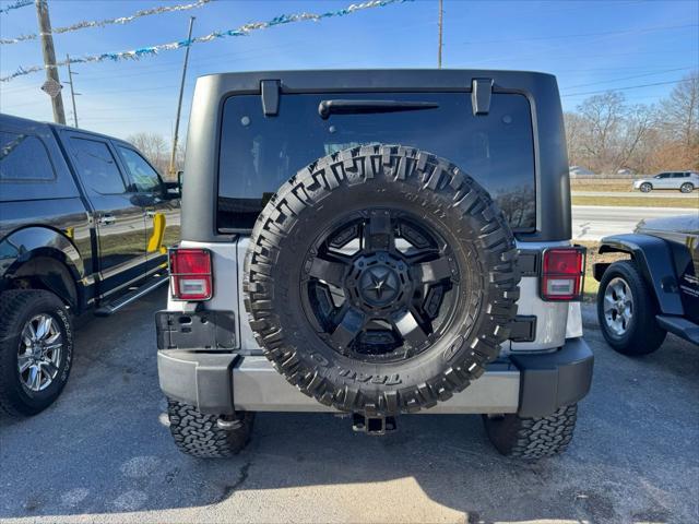 used 2014 Jeep Wrangler Unlimited car, priced at $13,990