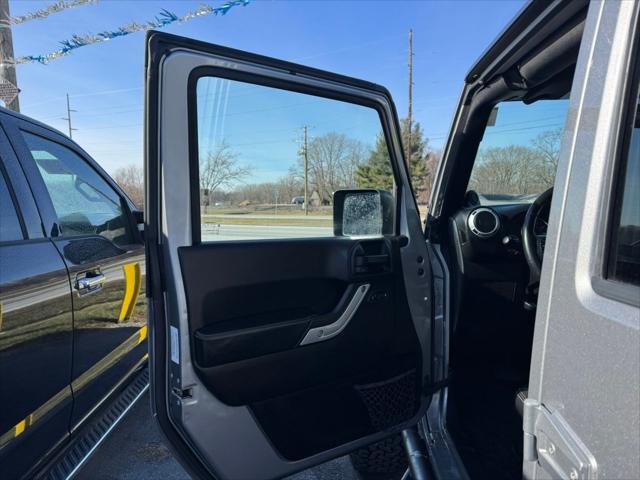 used 2014 Jeep Wrangler Unlimited car, priced at $13,990