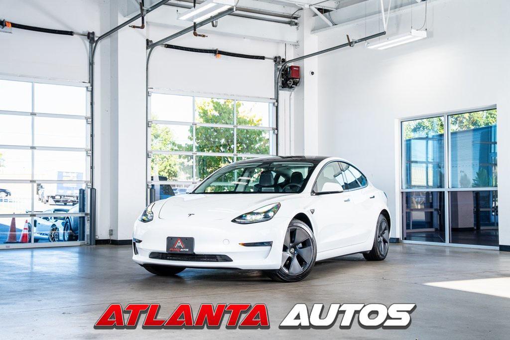 used 2023 Tesla Model 3 car, priced at $25,999