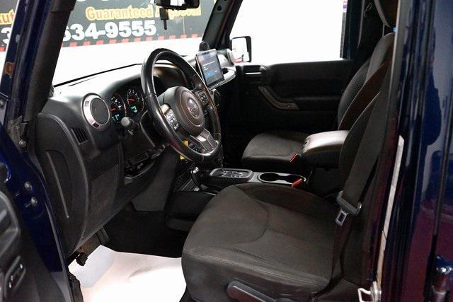 used 2013 Jeep Wrangler Unlimited car, priced at $12,899