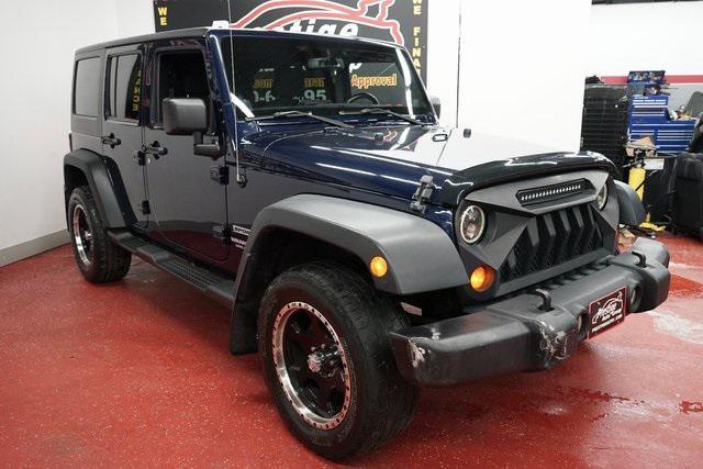 used 2013 Jeep Wrangler Unlimited car, priced at $12,899