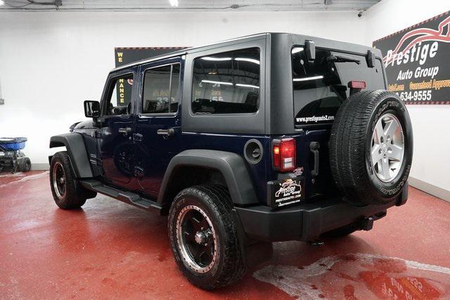 used 2013 Jeep Wrangler Unlimited car, priced at $12,899