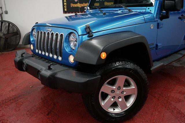 used 2015 Jeep Wrangler Unlimited car, priced at $19,268