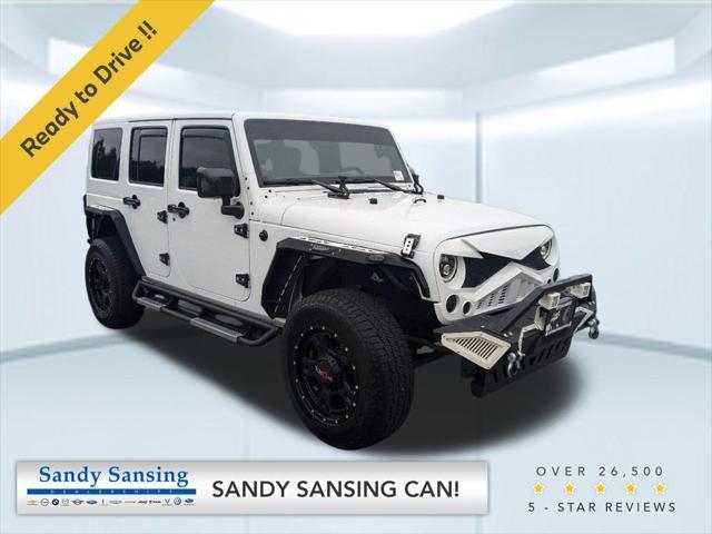 used 2014 Jeep Wrangler Unlimited car, priced at $23,912