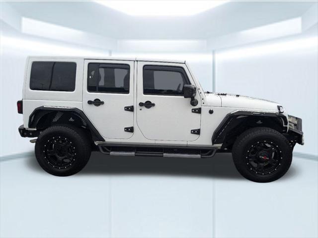 used 2014 Jeep Wrangler Unlimited car, priced at $23,912