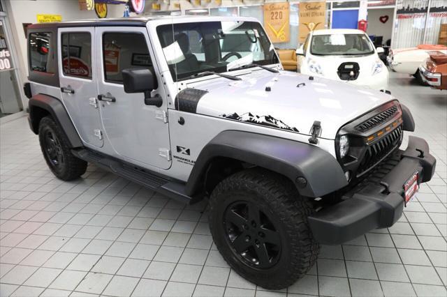 used 2009 Jeep Wrangler Unlimited car, priced at $16,896