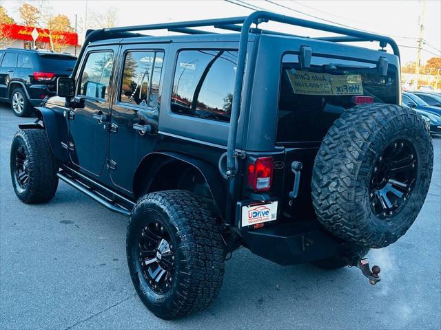 used 2014 Jeep Wrangler Unlimited car, priced at $16,990