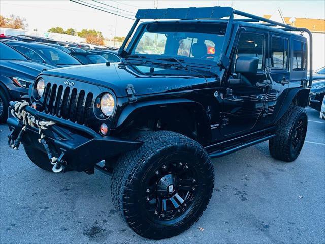 used 2014 Jeep Wrangler Unlimited car, priced at $16,990